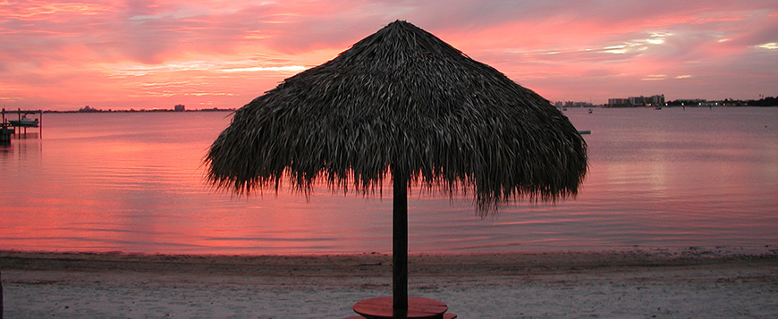picture of sunset and tiki hut